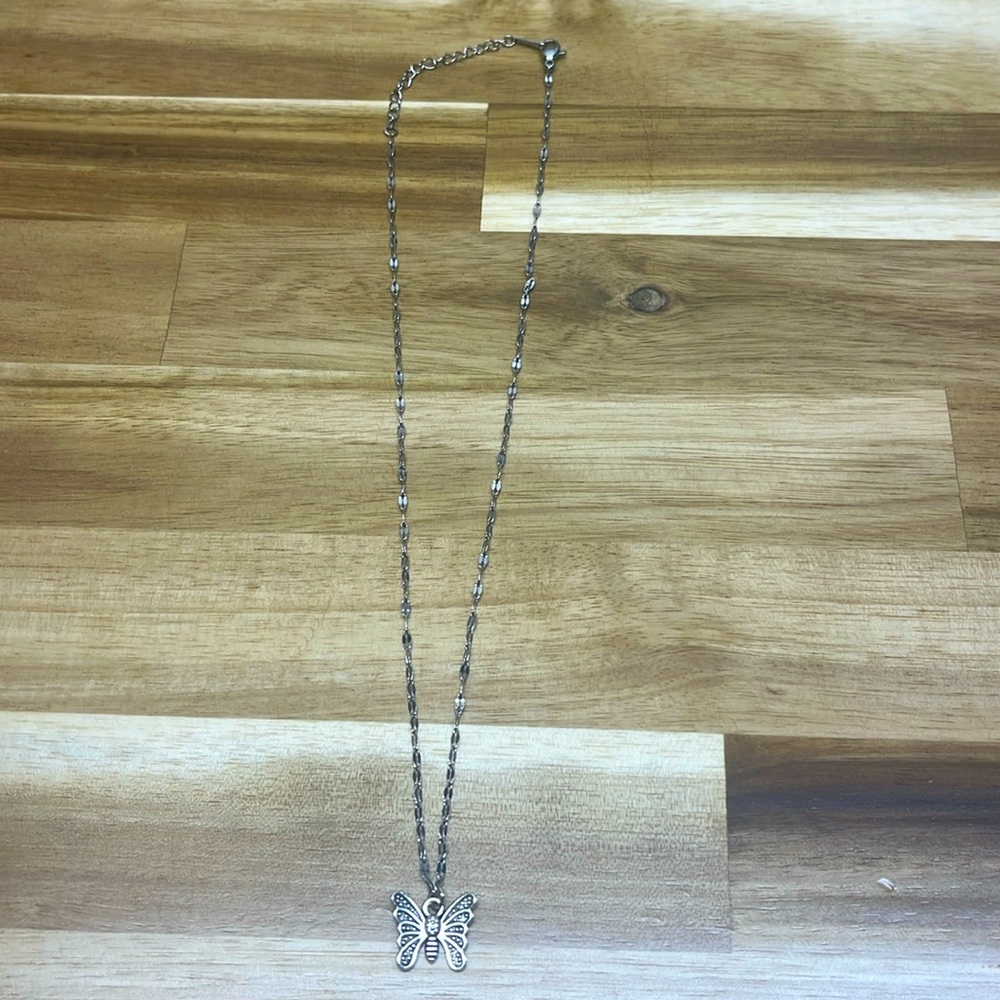 silver necklace with butterfly charm